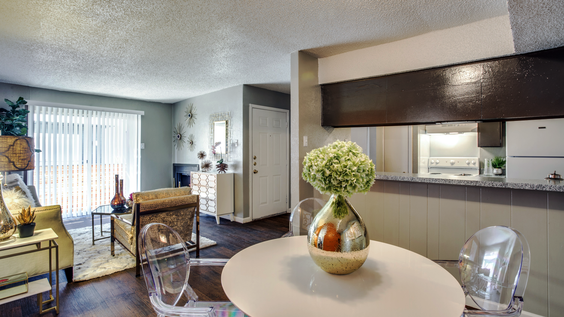 a living room and dining room area with a table and chairs at The  Hive